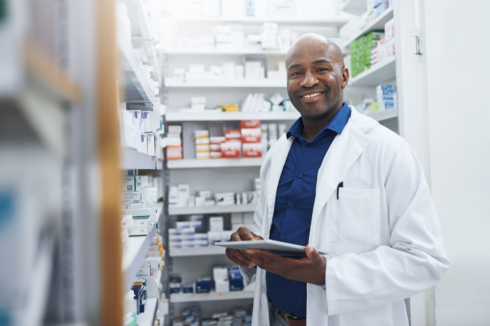 Black,Man,,Portrait,And,Pharmacist,With,Tablet,In,Clinic,Of